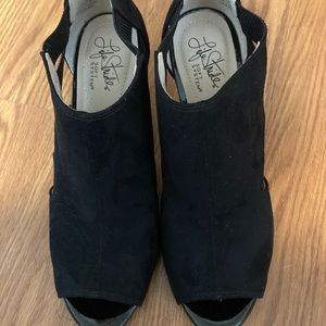 Women’s black, faux suede, heeled booties.